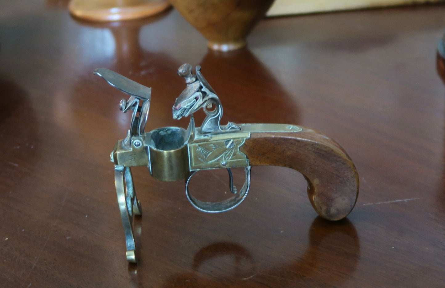A George III Brass, Iron and Mahogany Flintlock Tinder Pistol