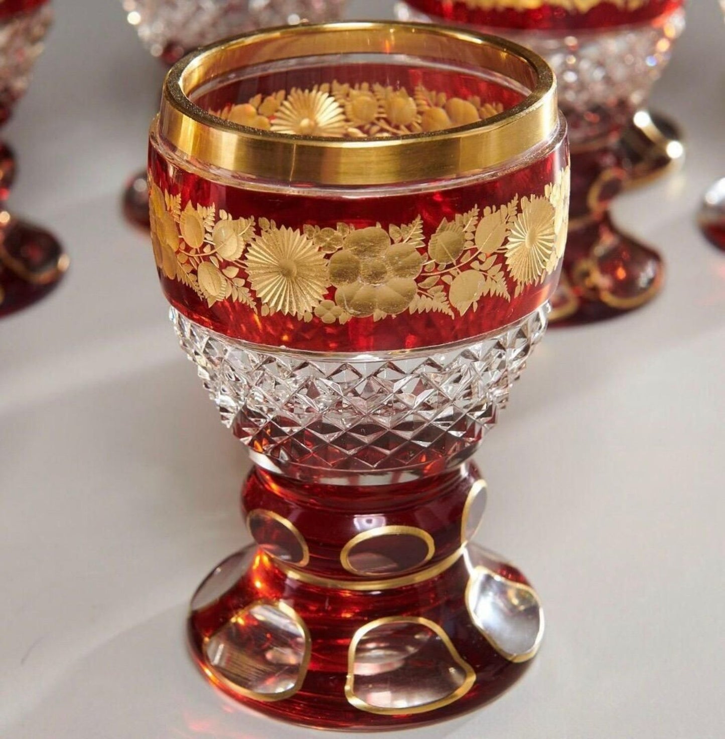 Set of 12 Ruby and Parcel-Gilt Bohemian Glasses, Late 19th Century