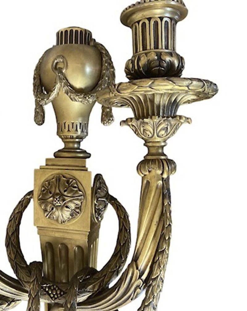 A Pair of Louis XVI Style Gilt Bronze Wall Lights, Stamped C within a diamond for Caldwell, circa 1930