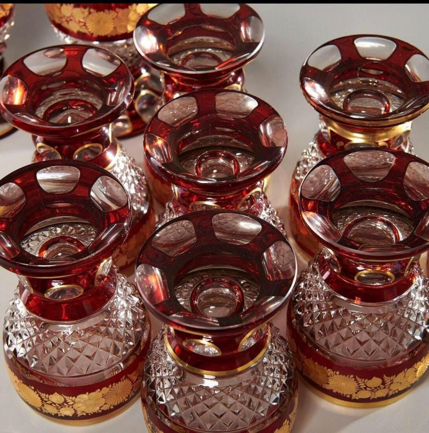 Set of 12 Ruby and Parcel-Gilt Bohemian Glasses, Late 19th Century