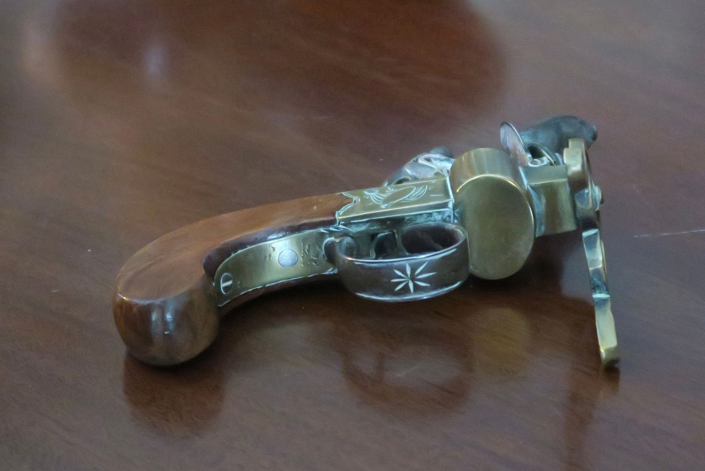 A George III Brass, Iron and Mahogany Flintlock Tinder Pistol