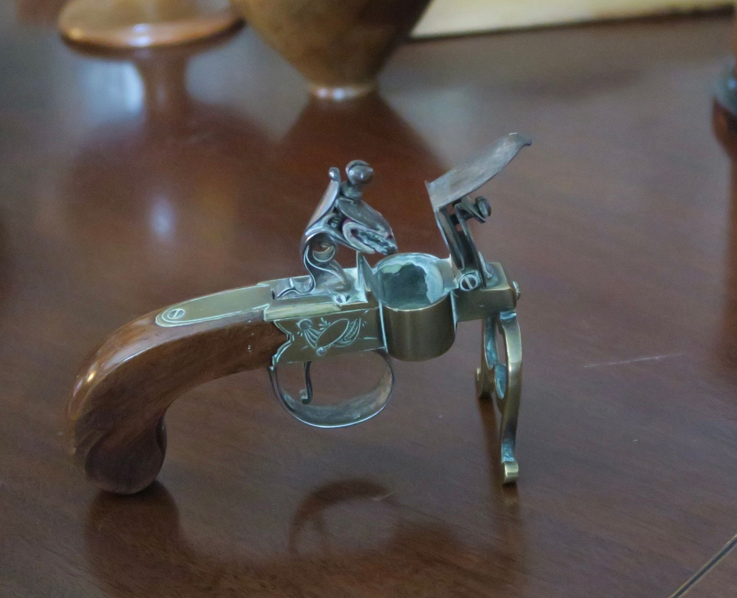 A George III Brass, Iron and Mahogany Flintlock Tinder Pistol