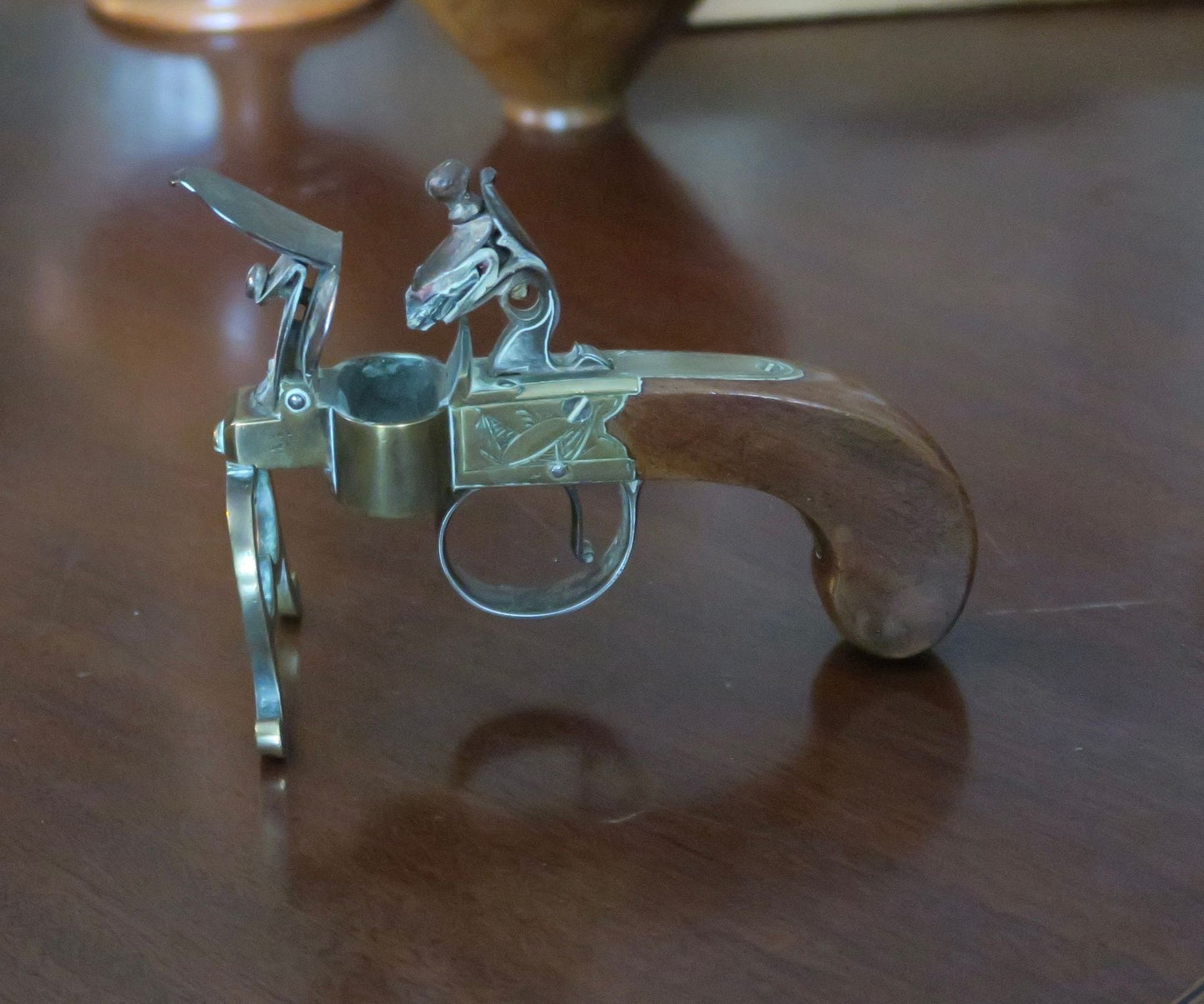 A George III Brass, Iron and Mahogany Flintlock Tinder Pistol