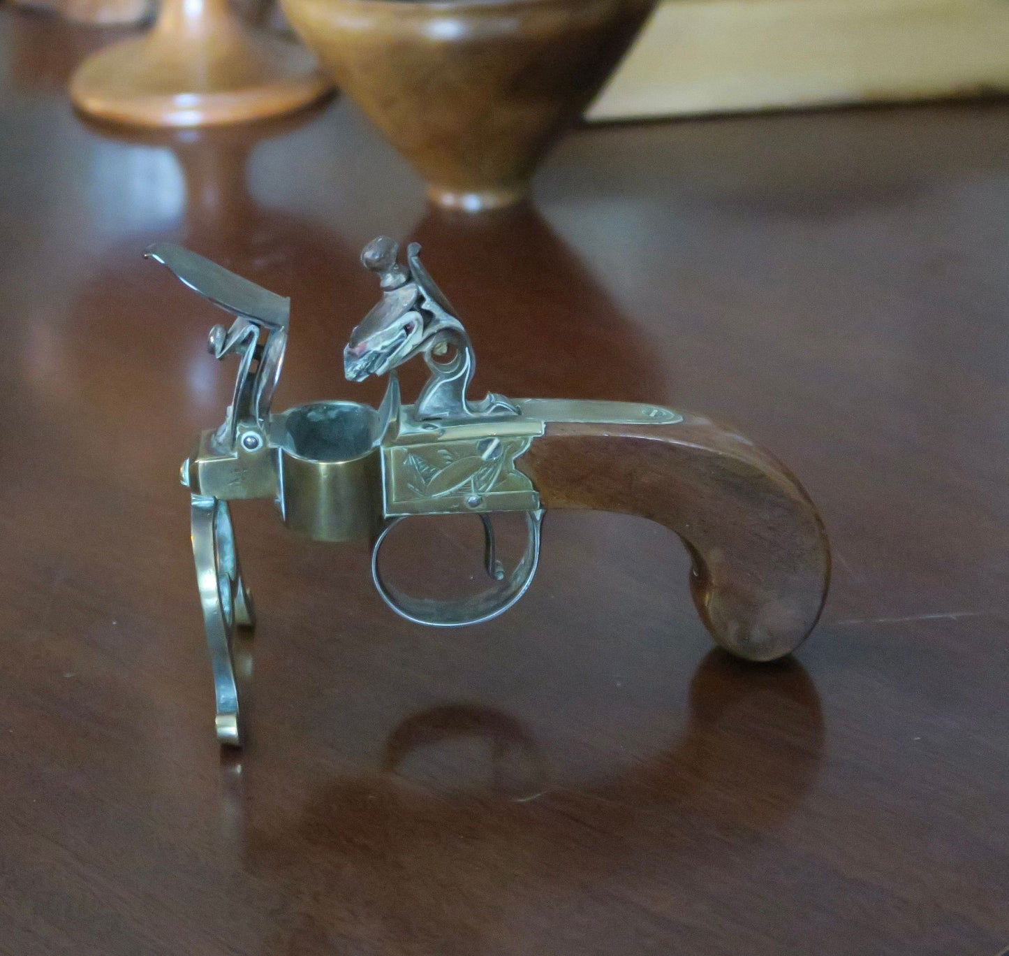 A George III Brass, Iron and Mahogany Flintlock Tinder Pistol