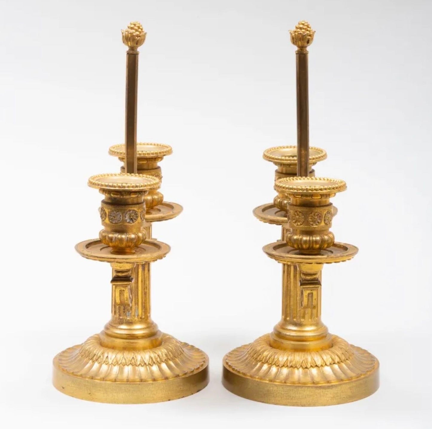 A Pair of Louis XVI Style Two-Light Ormolu Candlesticks