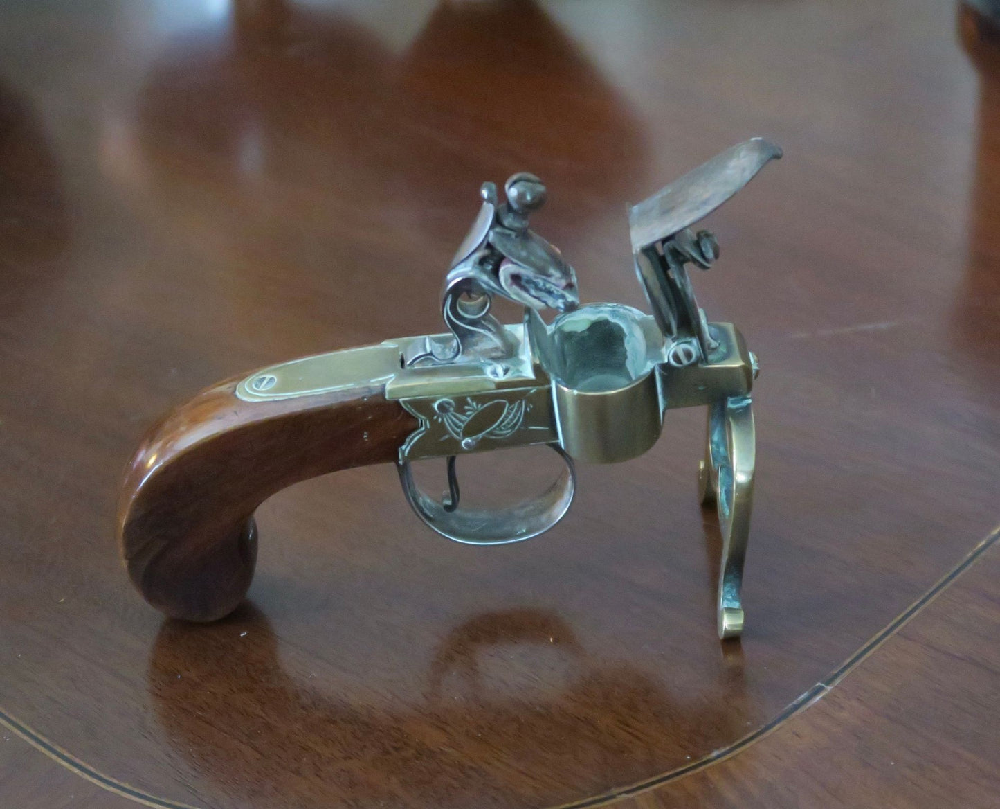 A George III Brass, Iron and Mahogany Flintlock Tinder Pistol